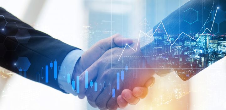 Two people shaking hands with financial graphics overlaid