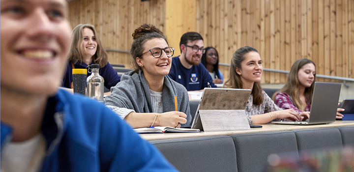 Various University of East Anglia  students in a lecture theatre  attending a lecture