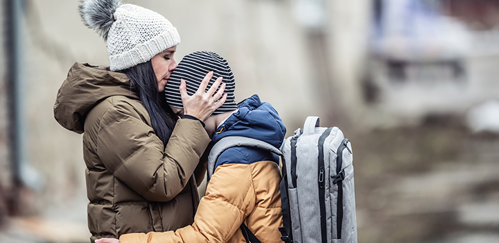 A woman embracing her son.