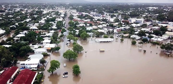 Buildings and land in a town or city under floodwater