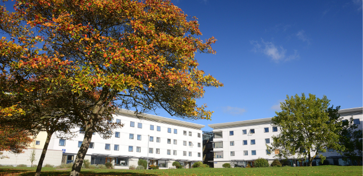 A white three-story accommodation building