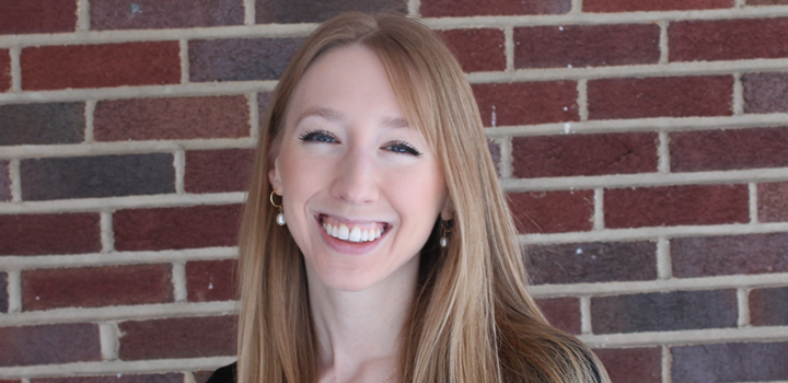 Headshot of Amanda Hodes with brick background