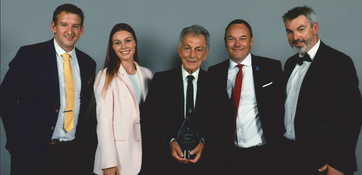 Norman Hart (pictured in middle) after accepting the AD Munrow Award