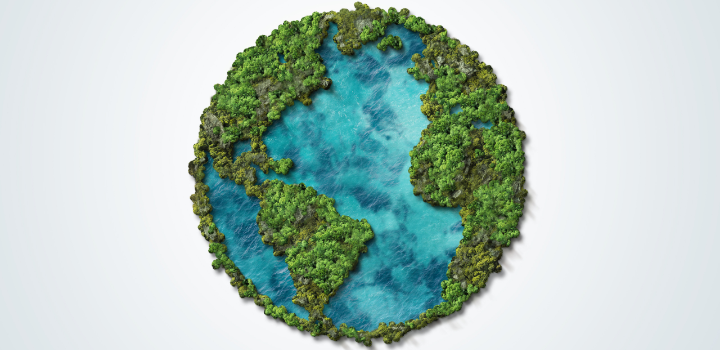 A picture of the world with the green land filled with forests and the water clean and clear