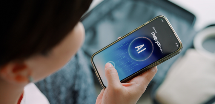 A person staring down at their phone with an AI chatbot on it