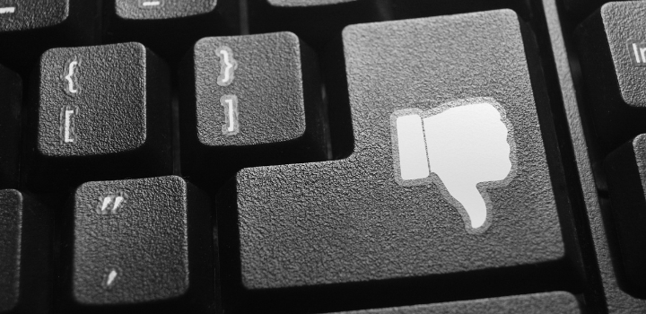 A button on a keyboard with a thumbs down emoji