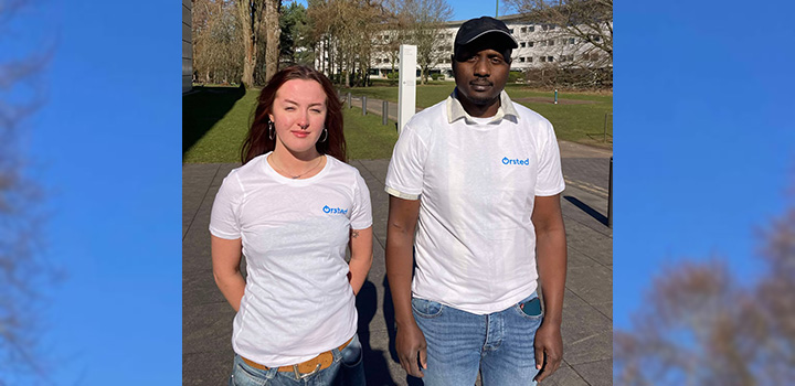 A man and a woman smiling at the camera