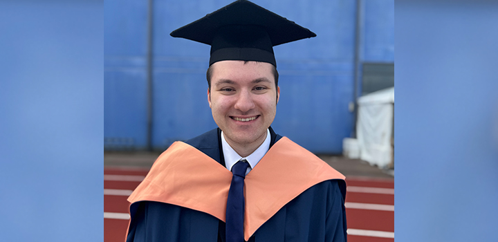 Matthew Stothard, wearing a graduation gown and cap