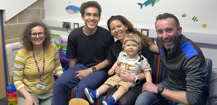 Researchers with a family who are taking part in the project.