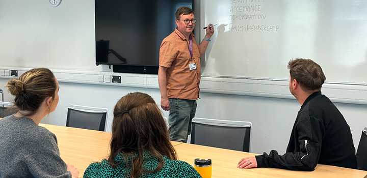 Dr Mark Gregory discussing the Secure Base model for foster carers and adopters with a group