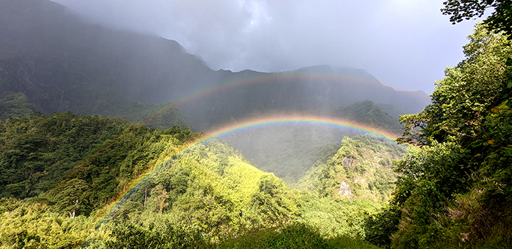 A rainbow in the mountains on the island of Tahiti.
