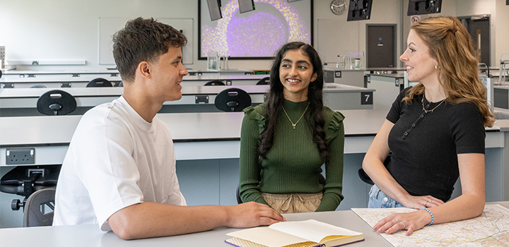 Students sat talking in a laboratory