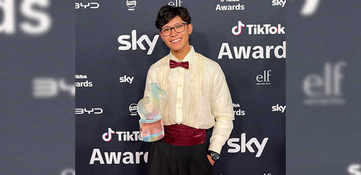 A man holding a trophy