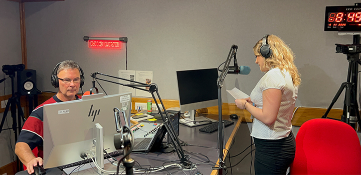 A man and a woman in a radio studio