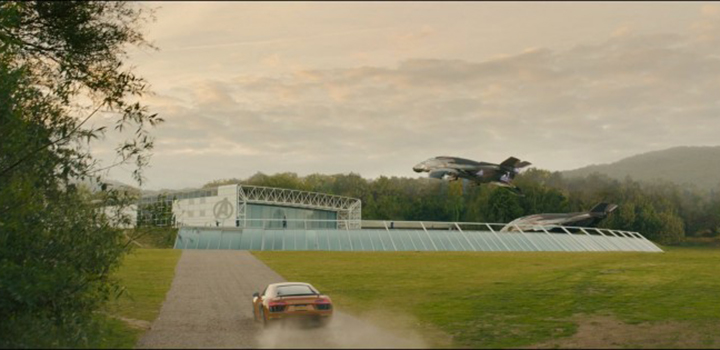 Car drives towards Sainsbury Centre on UEA campus