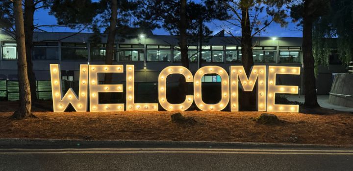 The word 'welcome' illuminated in big letters