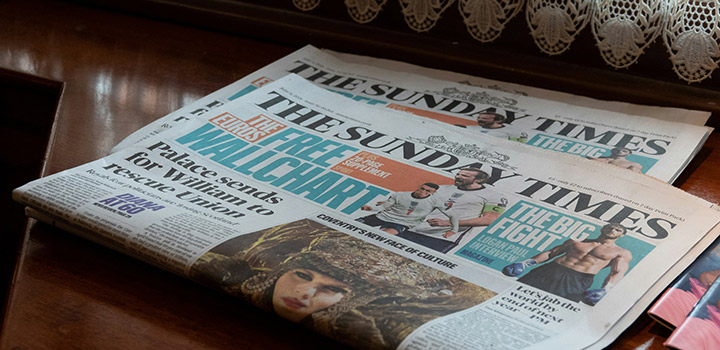 Newspapers on a table
