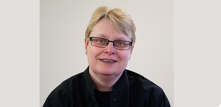 A woman smiling at the camera