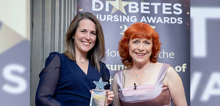 Andrea Lake (left) is presented with the Research Project of the Year award by Dr Sarah Jarvis MBE at a ceremony in London