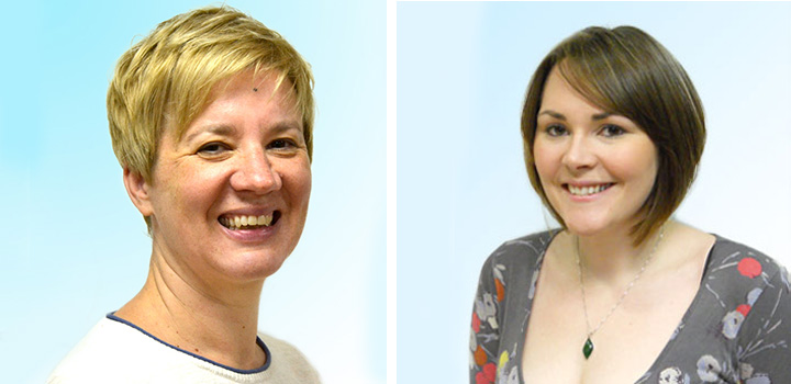 Two women smiling at camera