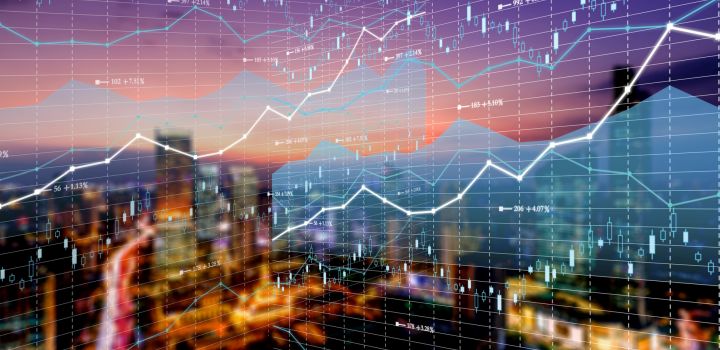 Double exposure image with business technology and abstract financial charts in sky on city background.