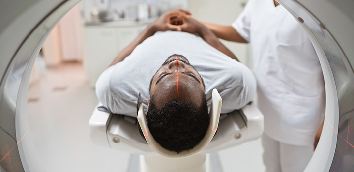 A man entering an MRI machine.