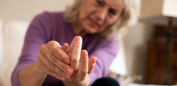 woman looking at hand