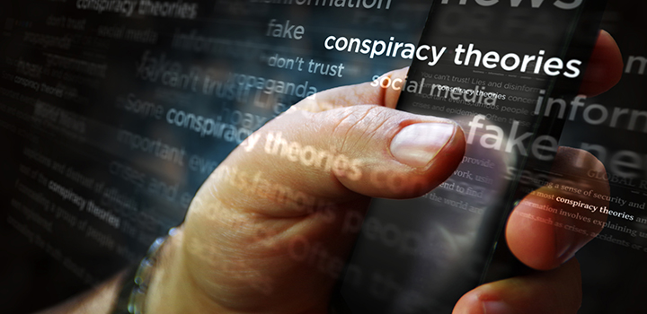 A man scrolls on his phone, with text graphics reading "conspiracy theory" overlayed.
