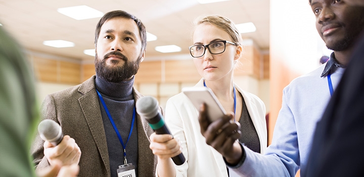 press journalists with microphones