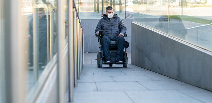 Wheelchair user on ramp
