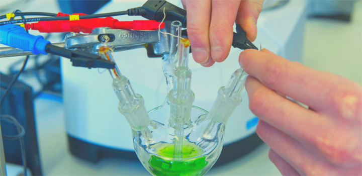 Hands around a test tube 