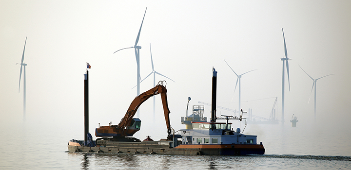 Engineers work on an offshore wind farm