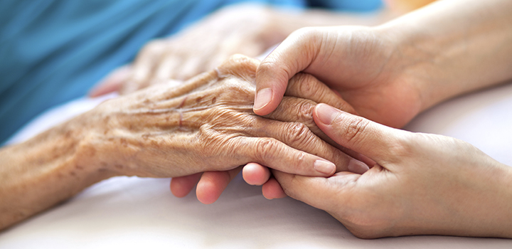 old and young hands holding