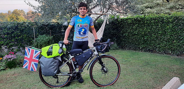 Claudio Barchiesi with his bike and a United Kingdom flag