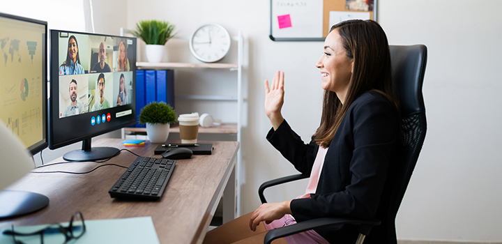 A woman sat at a home-working desk.