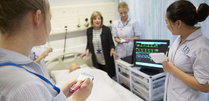 Nurses being taught in a hospital setting