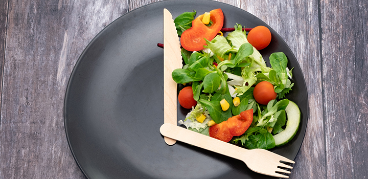 A salad arranged to look like a clock.