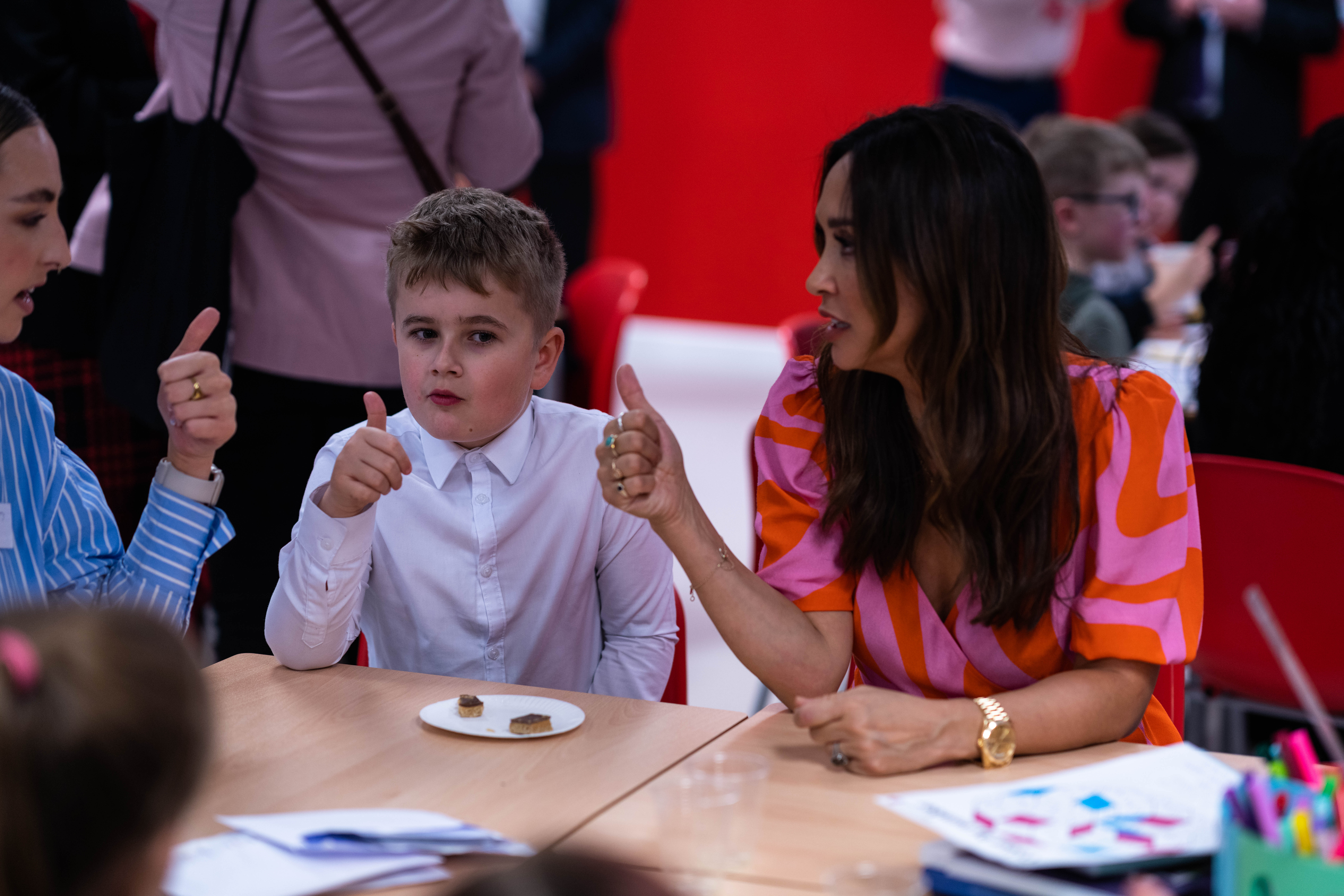 Myleene Klass (right) with a student and staff member